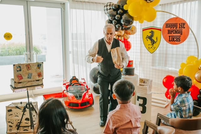 Frank performing for a group of children