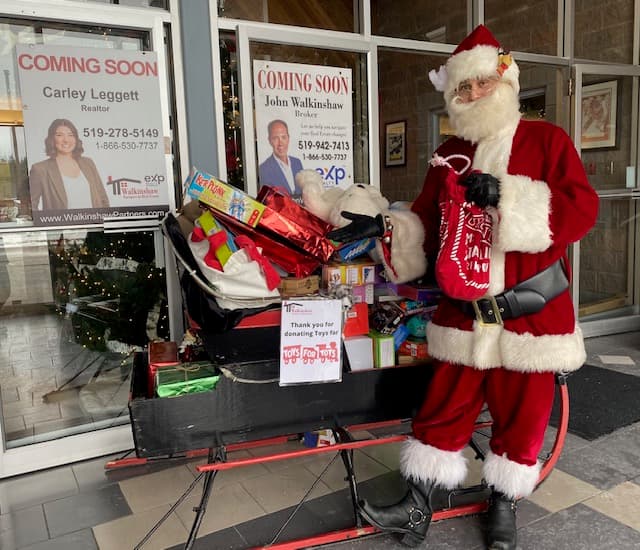 Santa with a sleigh full of gifts